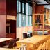 Scandic München Macherei in Munich lobby lounge with long table, chairs, plants and large windows