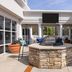 Hampton Inn ATL-Lawrenceville-I-85-Sugarloaf patio with stone fire pit and seating in Lawrenceville