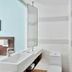 Fairfield by Marriott Bengaluru Outer Ring Road bathroom with vanity, toilet and glass shower in Bengaluru
