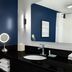 City Express by Marriott Washington, DC Northeast bathroom with navy accent wall, sink, mirror and folded towels