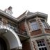 Hotel Villa Monte in Heist op den Berg, exterior with arched entrance and wrought-iron balconies
