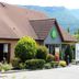 Campanile Grenoble Sud - Seyssins hotel exterior with mountain backdrop in Seyssins