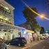 Agung Inn Yogyakarta hotel exterior at night with street-side entrance and parked car