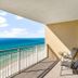 Balcony ocean view at Emerald Beach Resort in Panama City Beach with chairs overlooking the beach