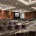 Andaz Scottsdale Resort & Bungalows conference room with rows of chairs and stage in Scottsdale