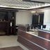 Home Suites Thief River Falls hotel lobby with front desk and fireplace seating area