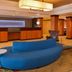 Fairfield Inn & Suites by Marriott Santa Maria lobby with blue curved seating and front desk