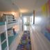 Pelican Beach Resort & Conference Center in Destin: bunk beds and colorful hallway in a beach suite