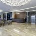 Nearport Hotel Sabiha Gokcen Airport lobby in Istanbul with seating area and elevator doors