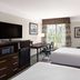 La Quinta Inn & Suites by Wyndham Bakersfield North guest room with two beds and window view