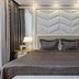 Boutique Hotel Buta Minsk bedroom with king bed, mirrored walls and bedside lamps
