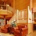 Norfolk Lodge & Suites, an Ascend Collection Hotel lobby with leather chairs and stone fireplace in Norfolk