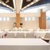 APA Hotel Kanazawa Nishi meeting room with rows of white tables and chairs under mirrored ceiling lights