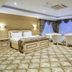 World Point Hotel Istanbul guest room with king bed, seating area and large windows in Istanbul