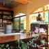 La Isla Bonita Resort in Boracay reception desk with clock, shelves, and tropical courtyard view