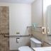 Express Inn & Suites San Antonio Near Sea World Medical Center bathroom with roll-in shower and grab bars