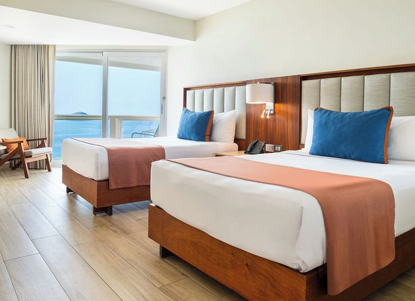 Park Royal Beach Ixtapa guest room with two beds and ocean-view balcony in Ixtapa