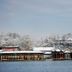 Beifang Langyue Hotel in Beijing by a snowy lakeside with traditional Chinese buildings