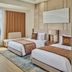 Grand Westside Manila Bay, Manila: twin beds in a modern room with city and bay views