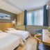Super 8 by Wyndham Beijing Xi Zhi Men guest room with two single beds and window seating in Beijing