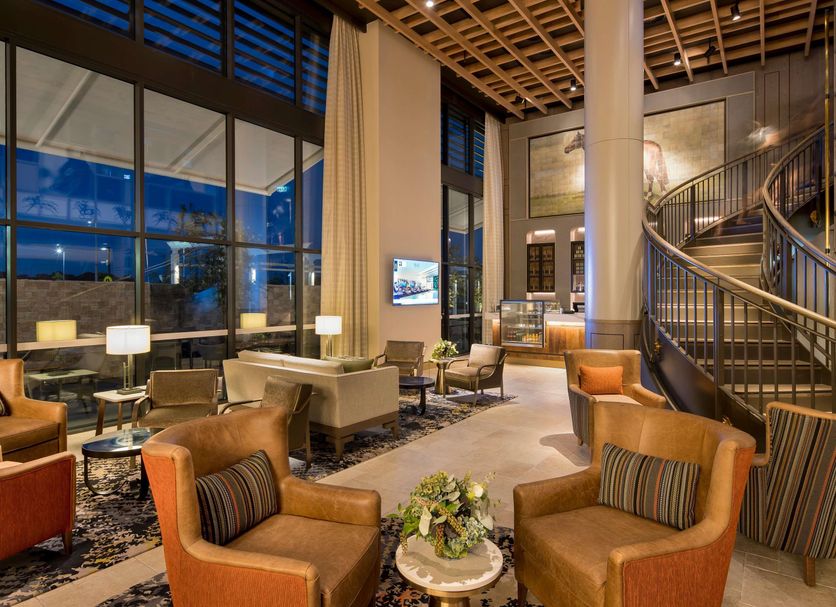 The William Inglis Hotel Warwick Farm - MGallery Collection lobby with tall windows, staircase and lounge seating