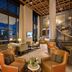 The William Inglis Hotel Warwick Farm - MGallery Collection lobby with tall windows, staircase and lounge seating