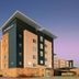 Residence Inn by Marriott Texarkana exterior at dusk with modern stone and beige facade