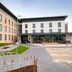 Premier Inn Edinburgh Airport - M9 Jct1 exterior with modern hotel entrance and parking area in Edinburgh