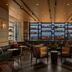 The Tess, Autograph Collection in Atlanta lounge with bar shelves, leather seating and city views