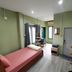 Tonkong Guesthouse & Restaurant in Chiang Khan, simple guest room with twin beds, window, and desk