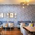 Leonardo Hotel Vienna Hauptbahnhof dining area with patterned blue wall and tables in Vienna