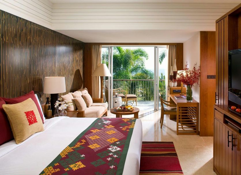 Mandarin Oriental, Sanya bedroom with balcony, tropical garden view, sofa, desk and TV
