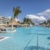 Ocean Eden Bay in Duncans features a large lagoon-style pool with palm trees and lounge chairs