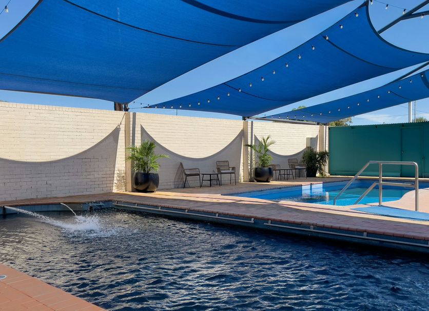 The Phoenix Artesian Spa Resort and Accommodation in Moree with shaded outdoor pool and spa area
