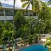 Le Plaza Hotel in Port Au Prince with a tropical courtyard pool and palm trees