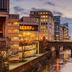 ibis budget Manchester Centre Pollard Street overlooking Manchester canal and bridge at dusk