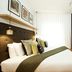 Wilde Aparthotels London Covent Garden guest room with bed, built-in shelving and window seat in London