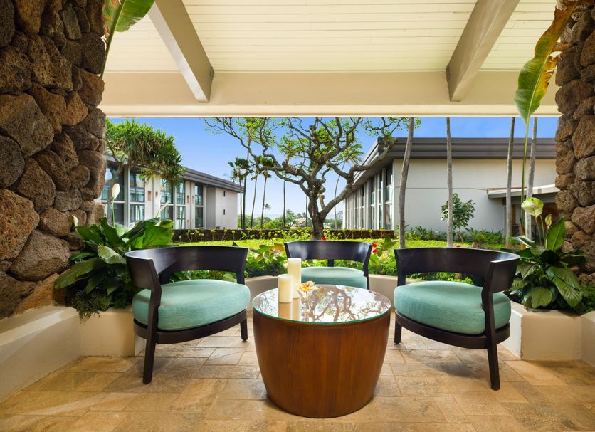 Hilton Garden Inn Kauai Wailua Bay in Kapaa patio seating with tropical garden view