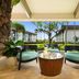 Hilton Garden Inn Kauai Wailua Bay in Kapaa patio seating with tropical garden view