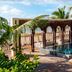 Secrets Tulum Resort And Beach Club in Tulum: rooftop infinity pool with palm trees and lounge chairs