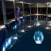 Kosta Boda Art Hotel in Kosta features an indoor pool with illuminated glass art and round columns.