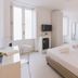 Dimore delle Zagare Ortigia Siracusa guest room with bed, TV, wardrobe and bright windows