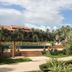 D.R. Lanta Bay Resort in Ko Lanta with tropical garden, pool, and palm trees under blue sky