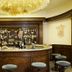 Abano Ritz Hotel Terme bar in Abano Terme with a curved counter, stocked shelves and bartender