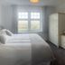 Beacon Country House Hotel & Luxury Shepherd Huts bedroom with king bed, window view and wardrobe in St. Agnes