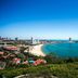 Sea Shore Garden Hotel Qingdao overlooking Qingdao beach and blue bay from a hillside view