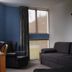 Tussock Grove Boutique, Ohakune: guest room with sofa, armchair and large windows