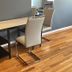 Nwk 457 Room 111-A in Newark features a dining table, chairs and wood-look flooring