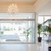 Vrissiana Boutique Beach Hotel in Protaras lobby entrance with chandelier, glass doors and potted plants