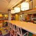 Fairfield Inn and Suites by Marriott Williamsport lobby with long communal table and colorful carpet